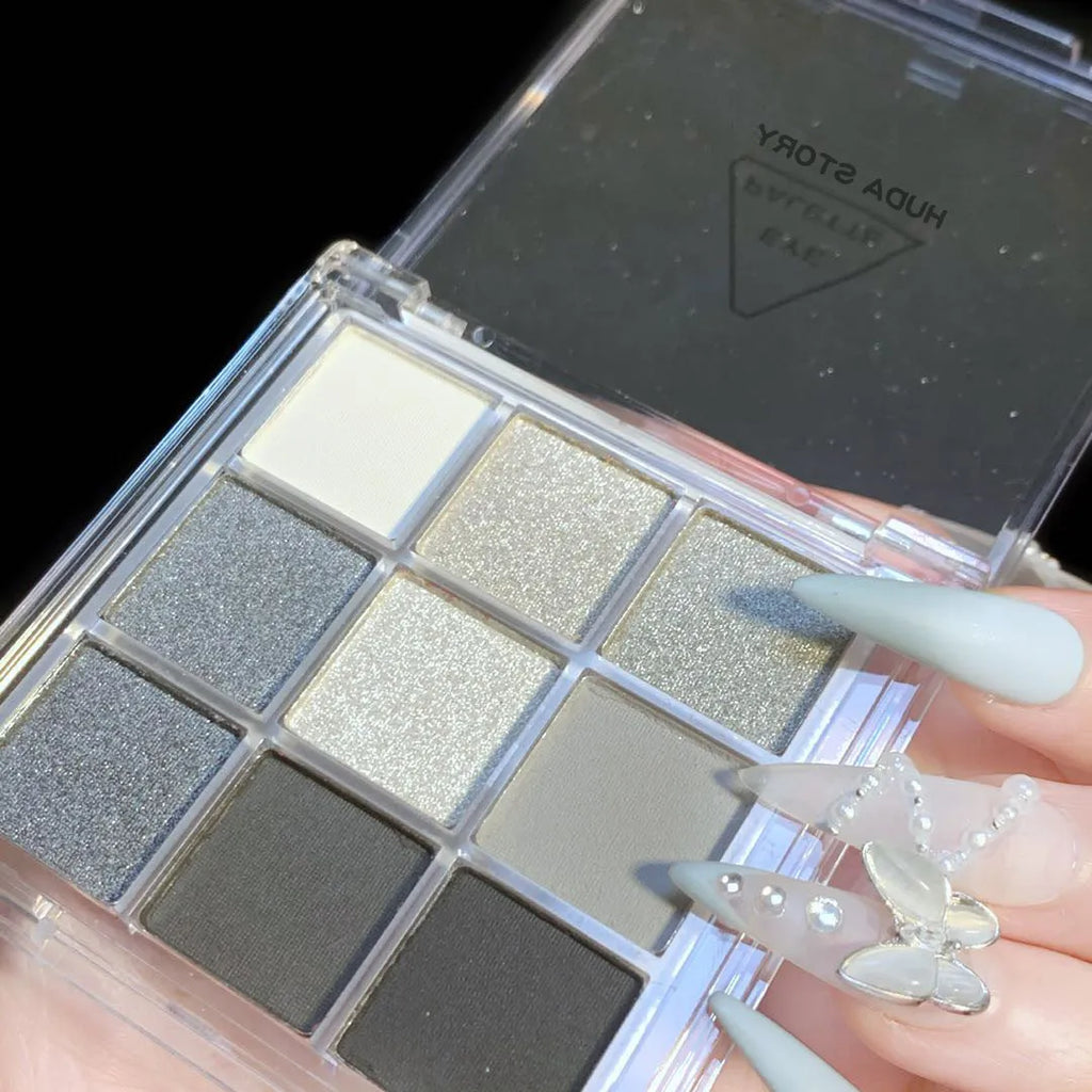 Smoked nine-colour eye shadow palette showing white, silver, black and grey shades