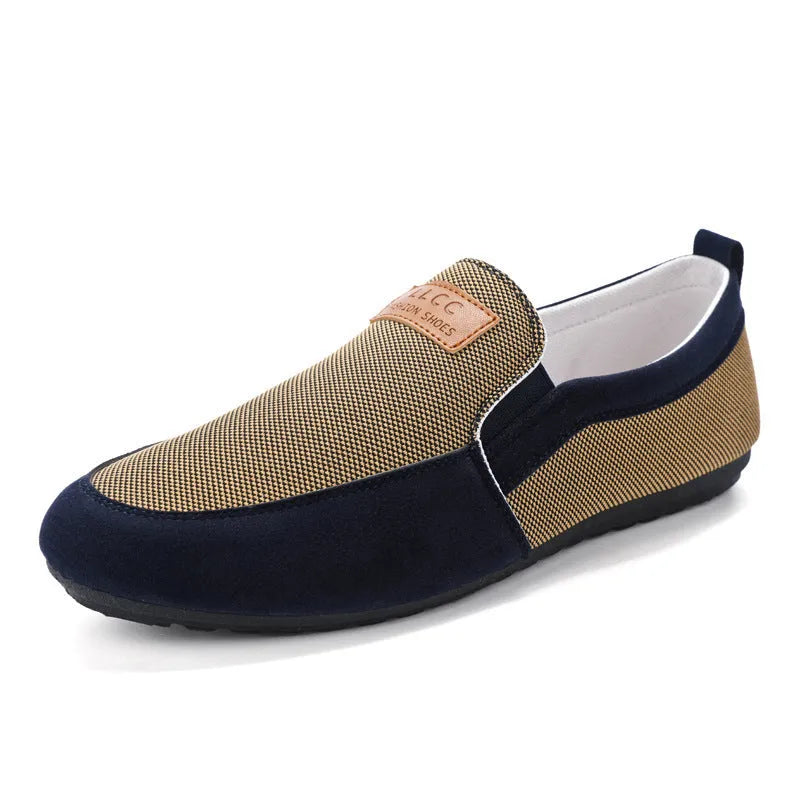 Men's grey canvas casual board shoes with round toe and rubber sole.