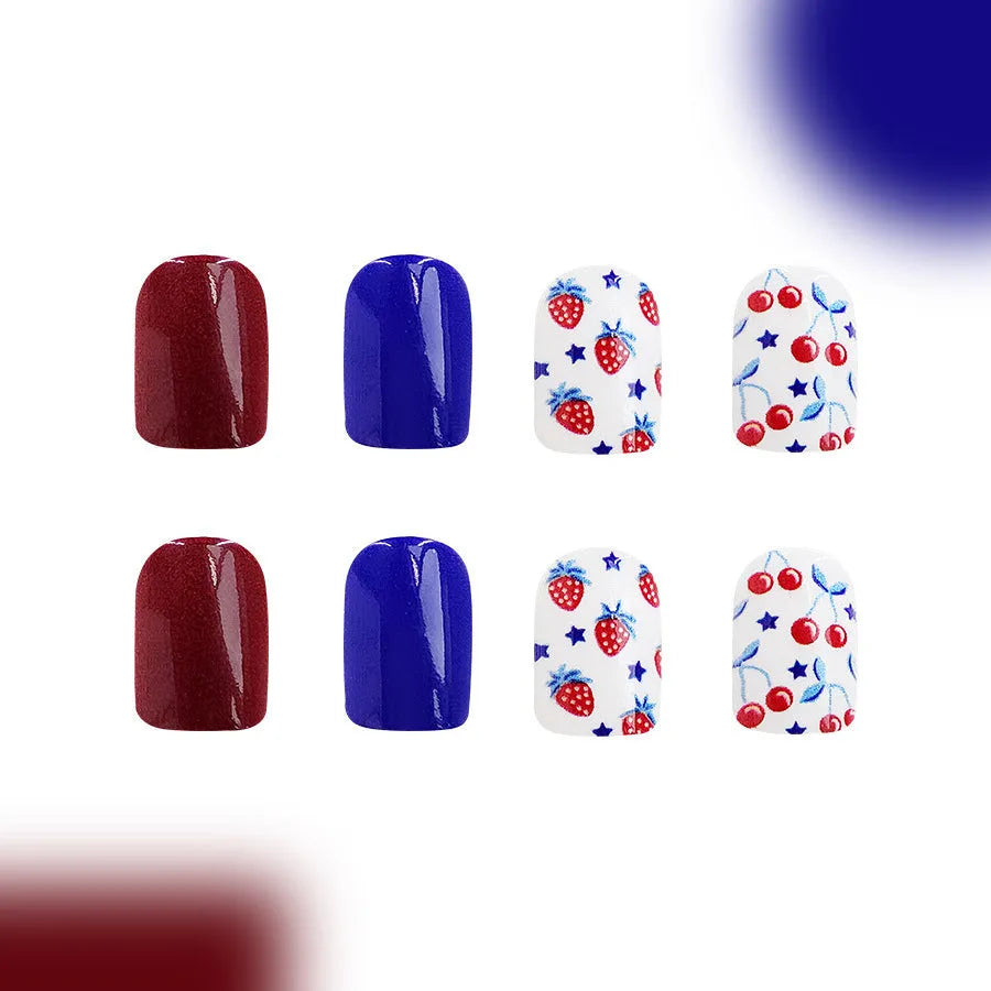 Set of 24 glossy red and blue press-on nail stickers with a strawberry pattern design for Independence Day.