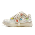 Milky white retro skateboard shoes with low-top lace-up design and platform sole