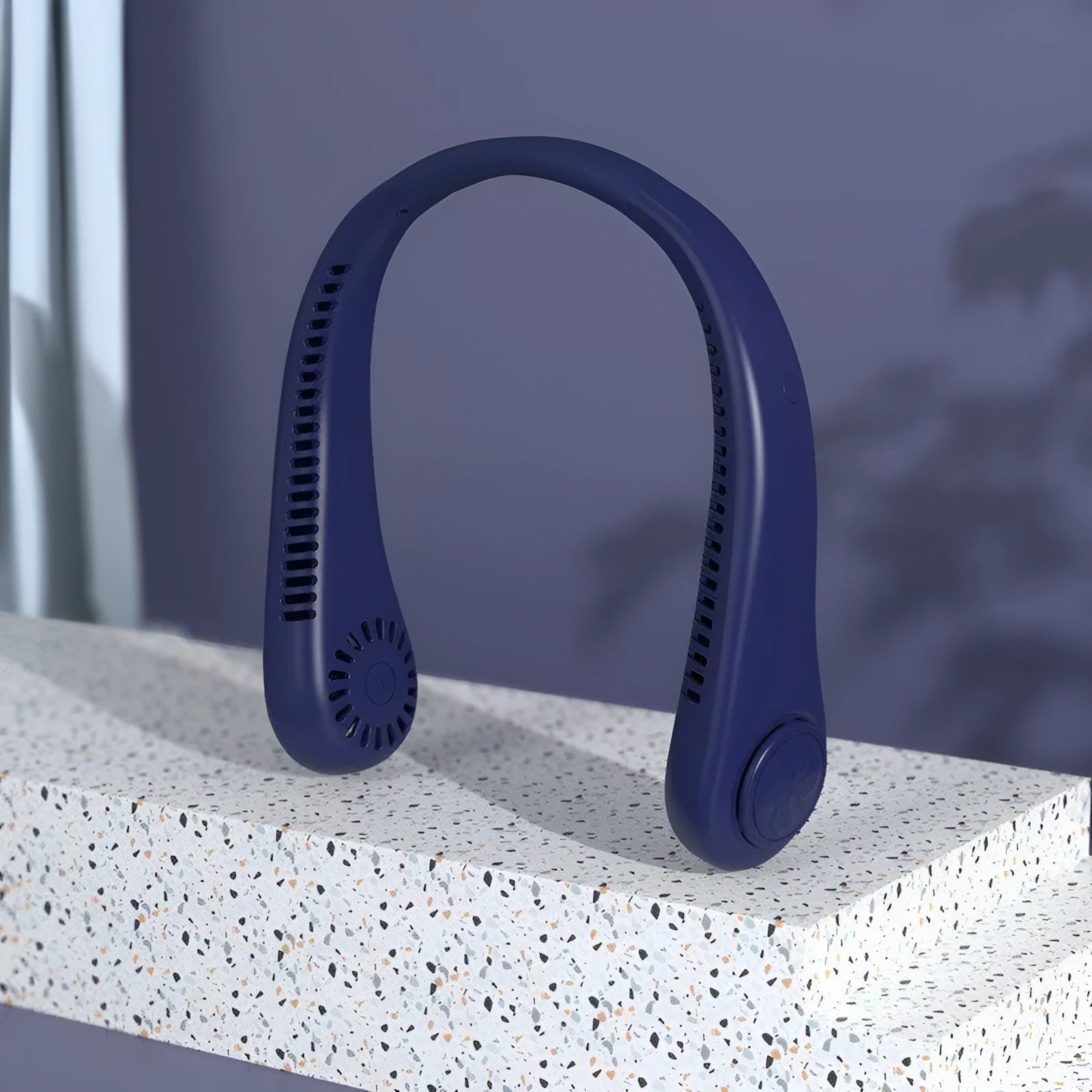 Blue bladeless neck fan hanging around a person's neck, showing USB charging port and control buttons.
