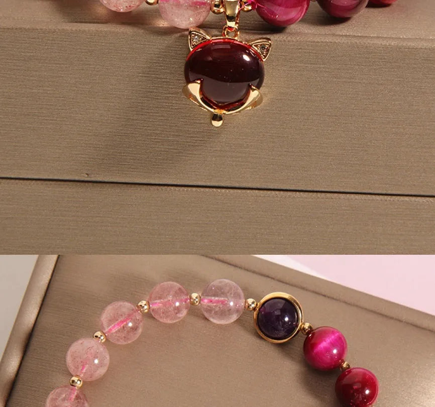 Strawberry crystal bracelet on wrist showing elastic rope construction and natural stone colour