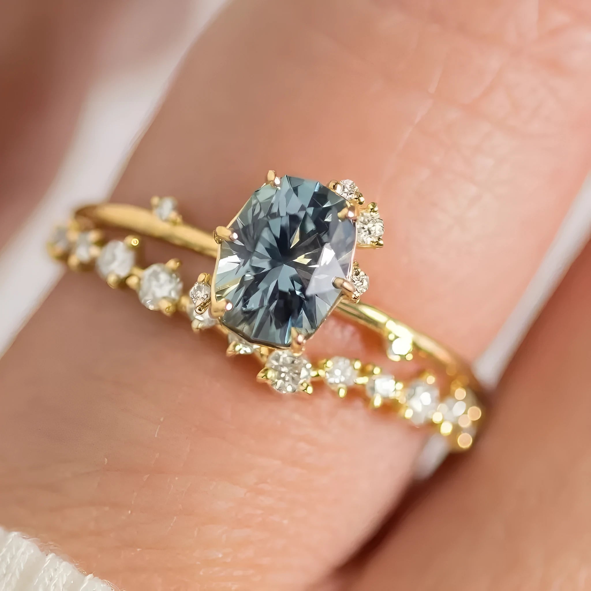 Gold-plated floral ring with green zircon stone, shown on female hand