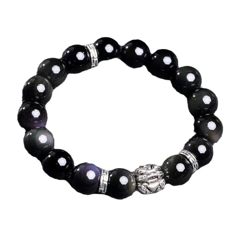 Natural obsidian and Silver 999 Cloud Year bracelet in simple unisex style on wrist.