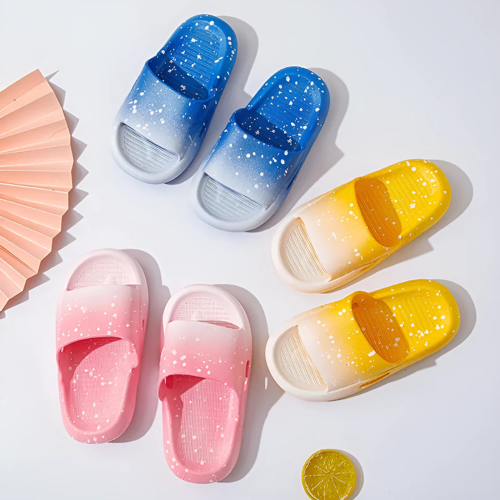 Gradient coloured PVC slipper sandals for children on a white background.