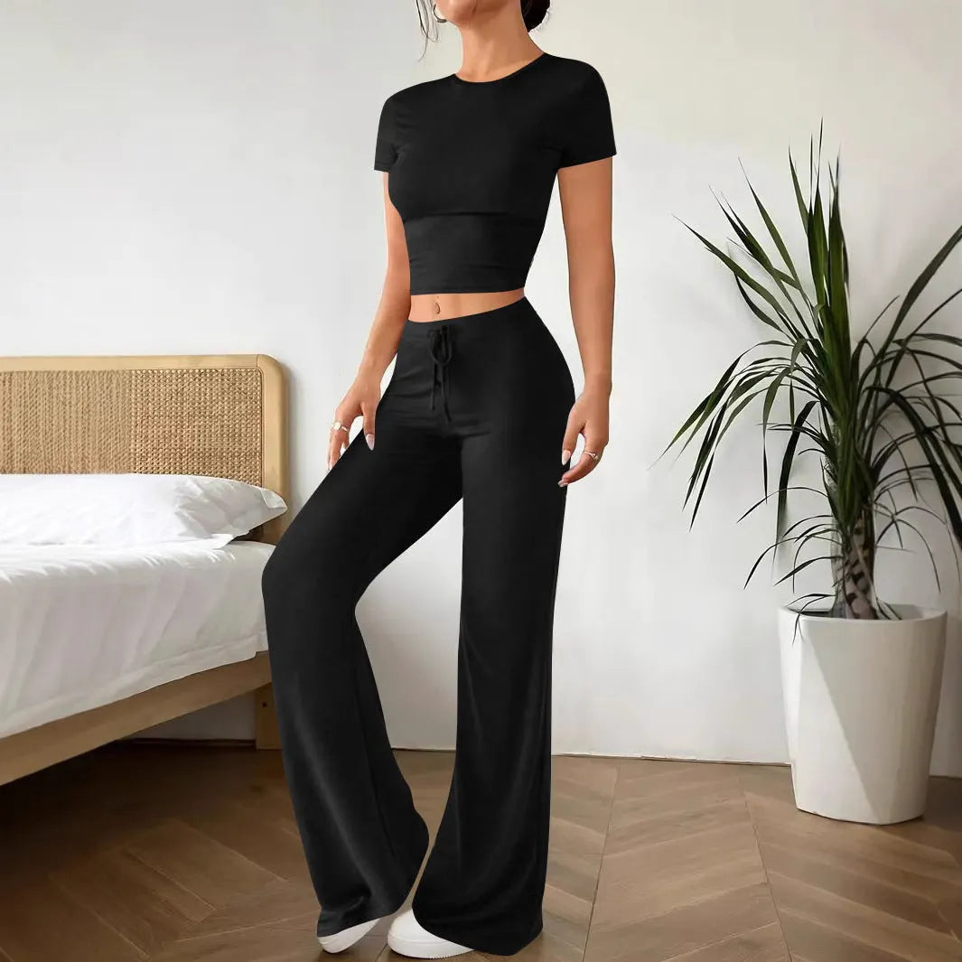 Black high waist trousers and short sleeve t-shirt women's co-ord set on a hanger