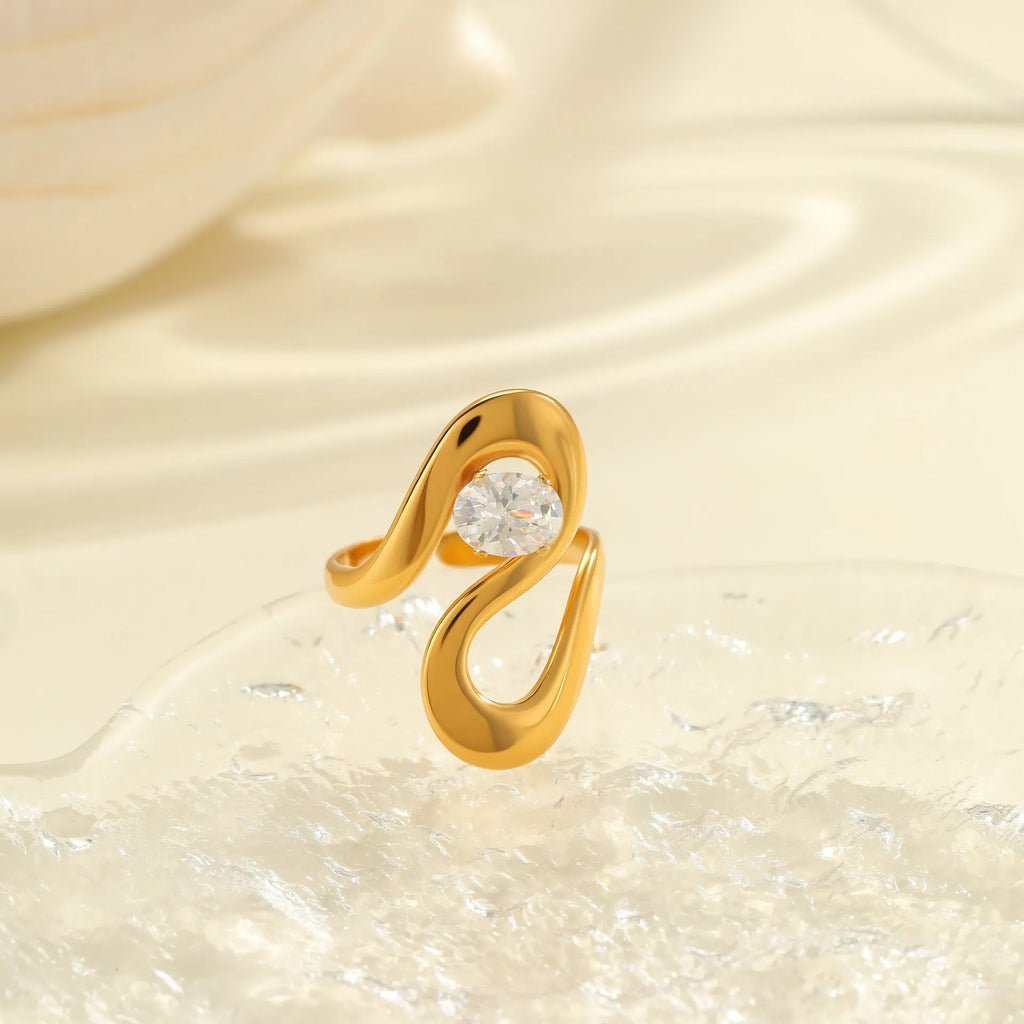 Stainless steel geometric zircon ring with open mouth adjustable design on a woman's hand.
