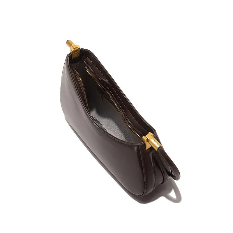 Women's oval shaped PU commuter handbag in multiple colours with internal zip compartment