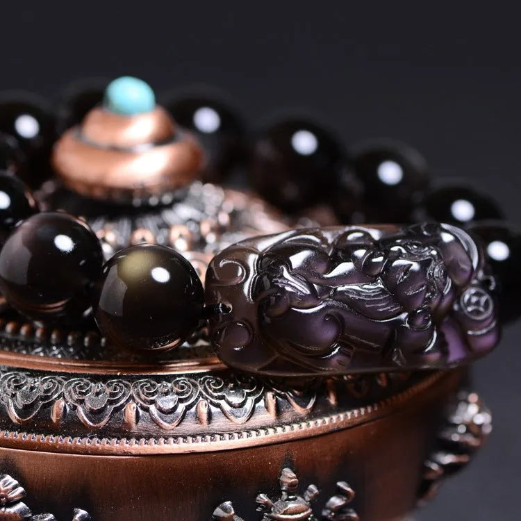 Polished crystal Pi Xiu bracelet with ice stone beads on wrist