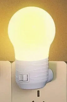 Plug-in bedside baby night light in white, blue, or pink shell with white or warm LED light.