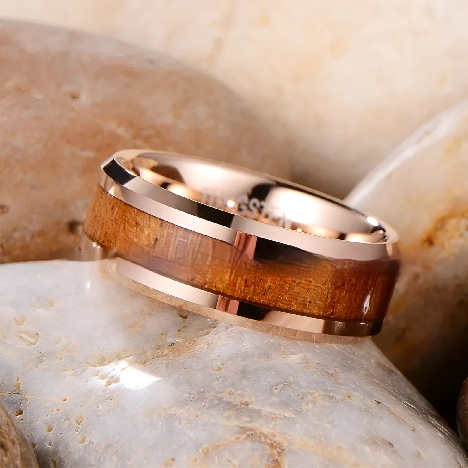 Men's tungsten ring with 8mm wide band featuring wood and leather inlay, shown in rose gold finish.