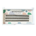 Black V-shaped fairy fishtail false eyelashes with thick segments on a clear tray.