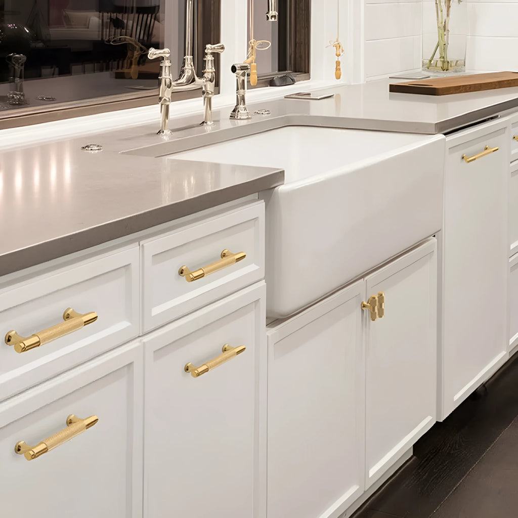 Aluminium furniture handle with brushed brass finish showing European style design