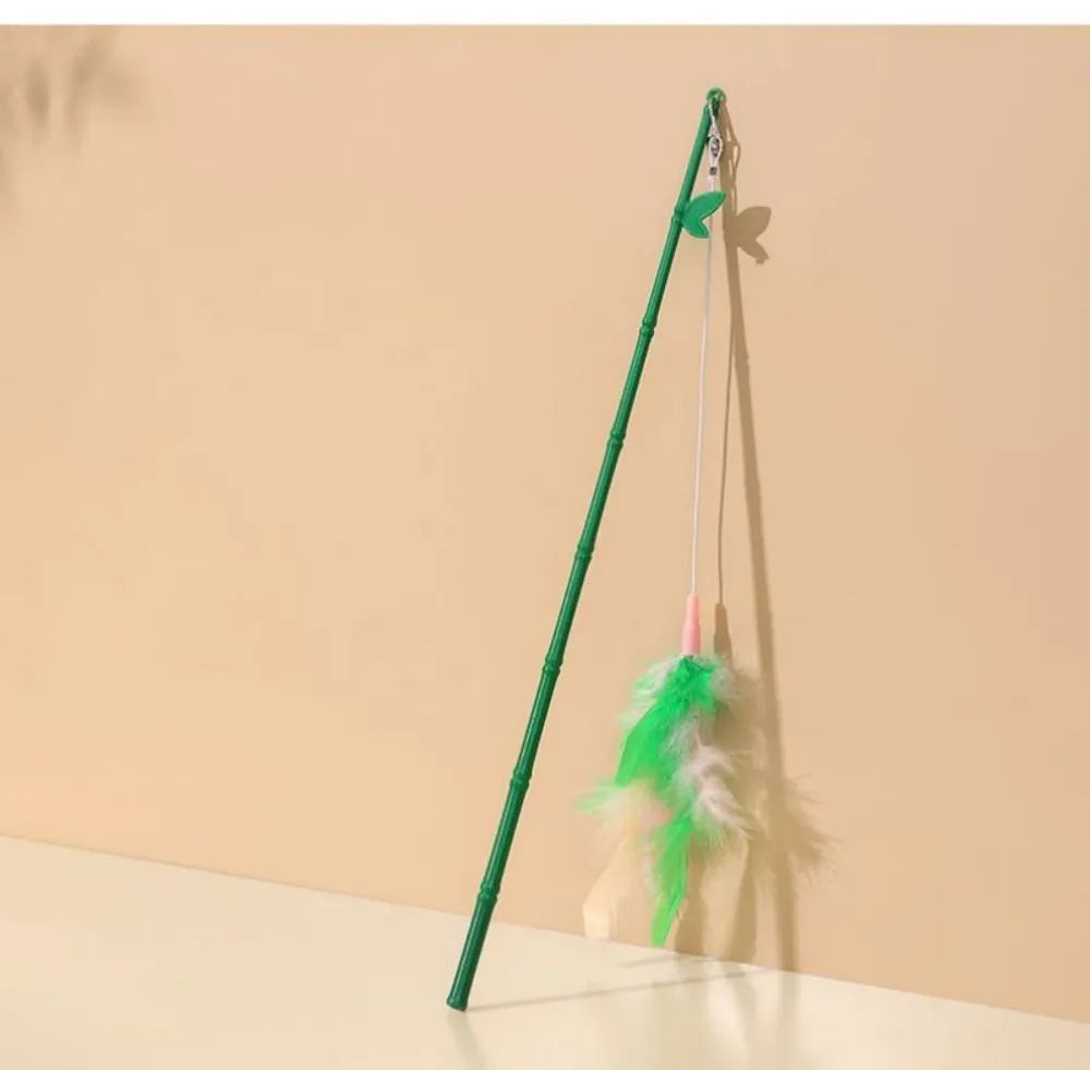 Green interactive cat feather wand toy with bells and durable construction for playful stimulation