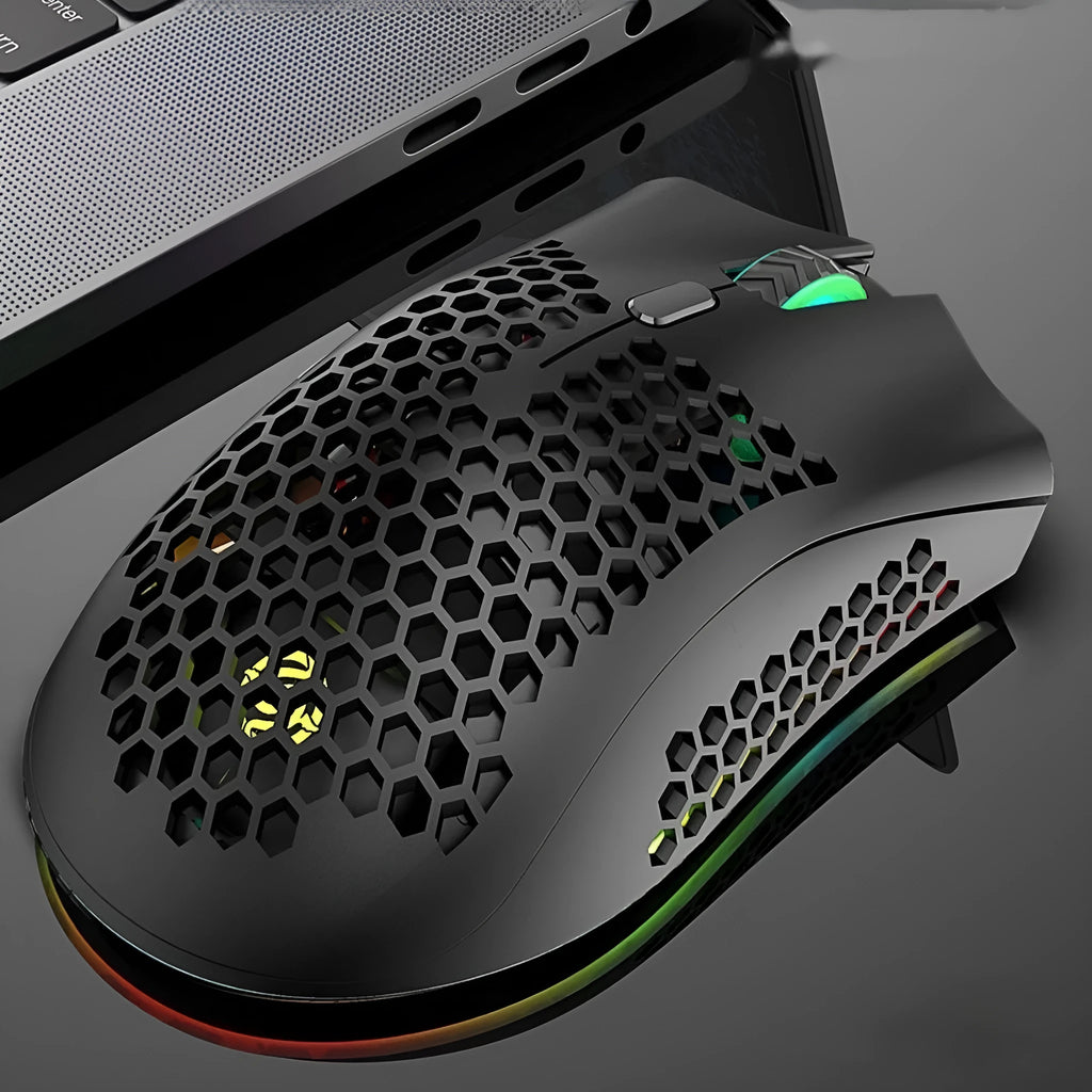 Hollow-out wireless gaming mouse with glowing light, shown in cyan colour on a desk.