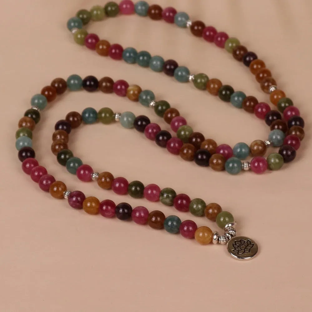 108-bead multi-layer lotus hanging bracelet in a tourmaline colour with alloy construction.