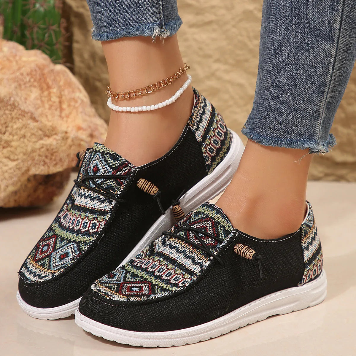 Women's low-top flat slip-on shoes in black, dark grey, or khaki with a round toe and rubber sole.