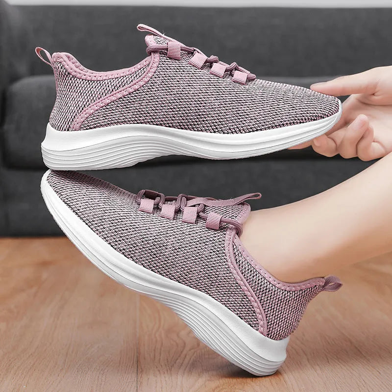 Women's flyknit mesh casual sneakers in black colour with lace-up front and EVA sole