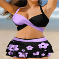 Women's purple two-piece swimsuit with separate skirt and lace-up details on high-waisted briefs