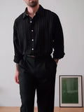 Black pinstriped polyester button-down shirt with collar, shown front view