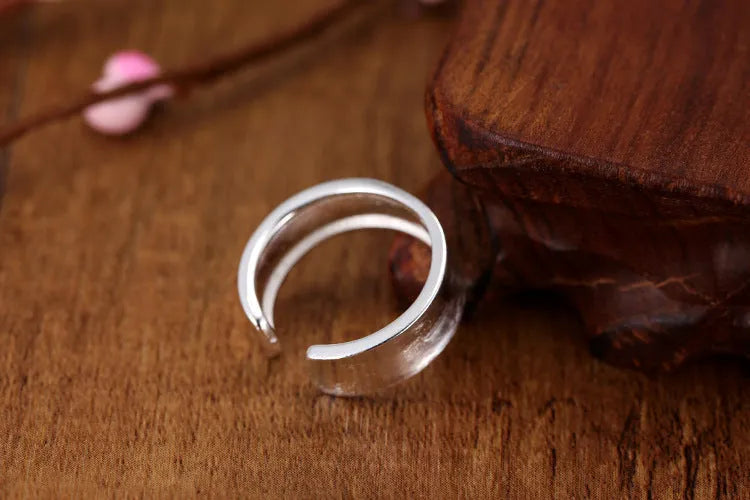 Geometric open ring with frosted sterling silver finish and adjustable opening