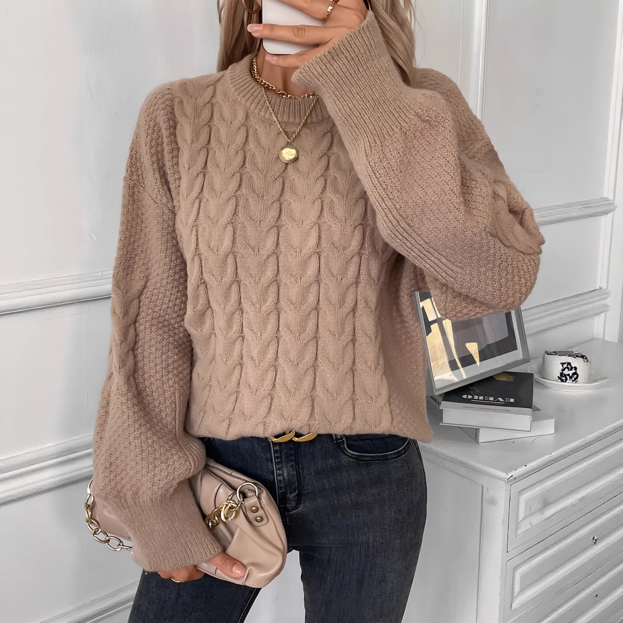 Women's twist design casual sweater in beige colour showing loose fit and round neckline