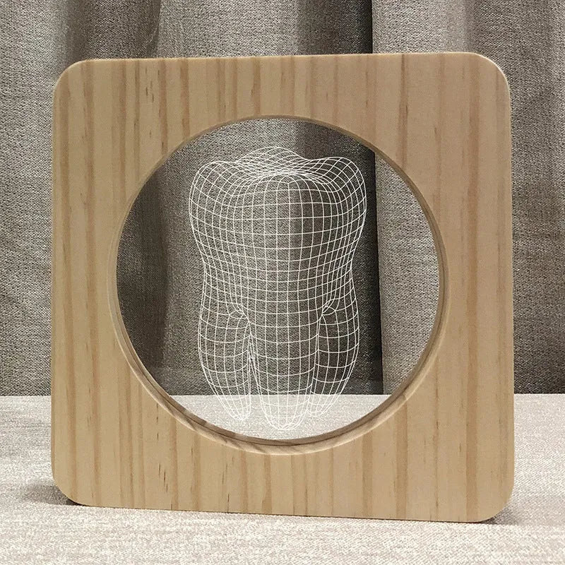 Tooth-shaped wood colour acrylic USB night light on a surface, showing compact size.