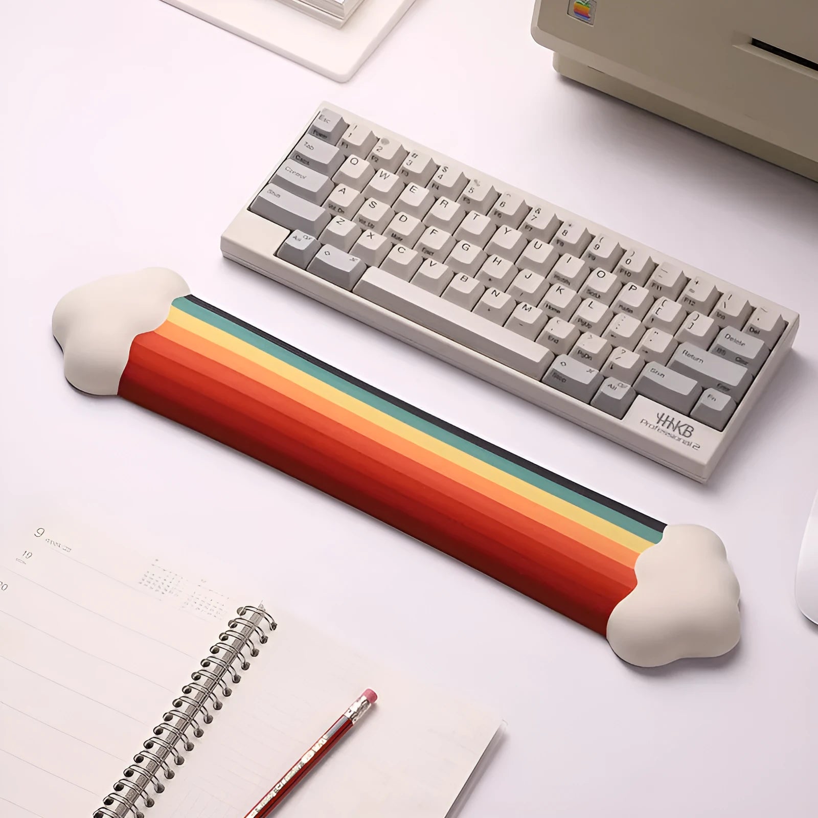 Silica gel wrister mouse pad and keyboard support set in a pastoral cloud pattern on a desk.