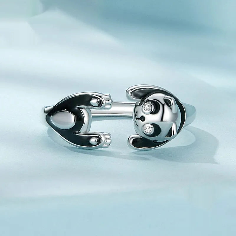 Adjustable sterling silver panda open ring with white gold plating, showing animal design and opening mechanism