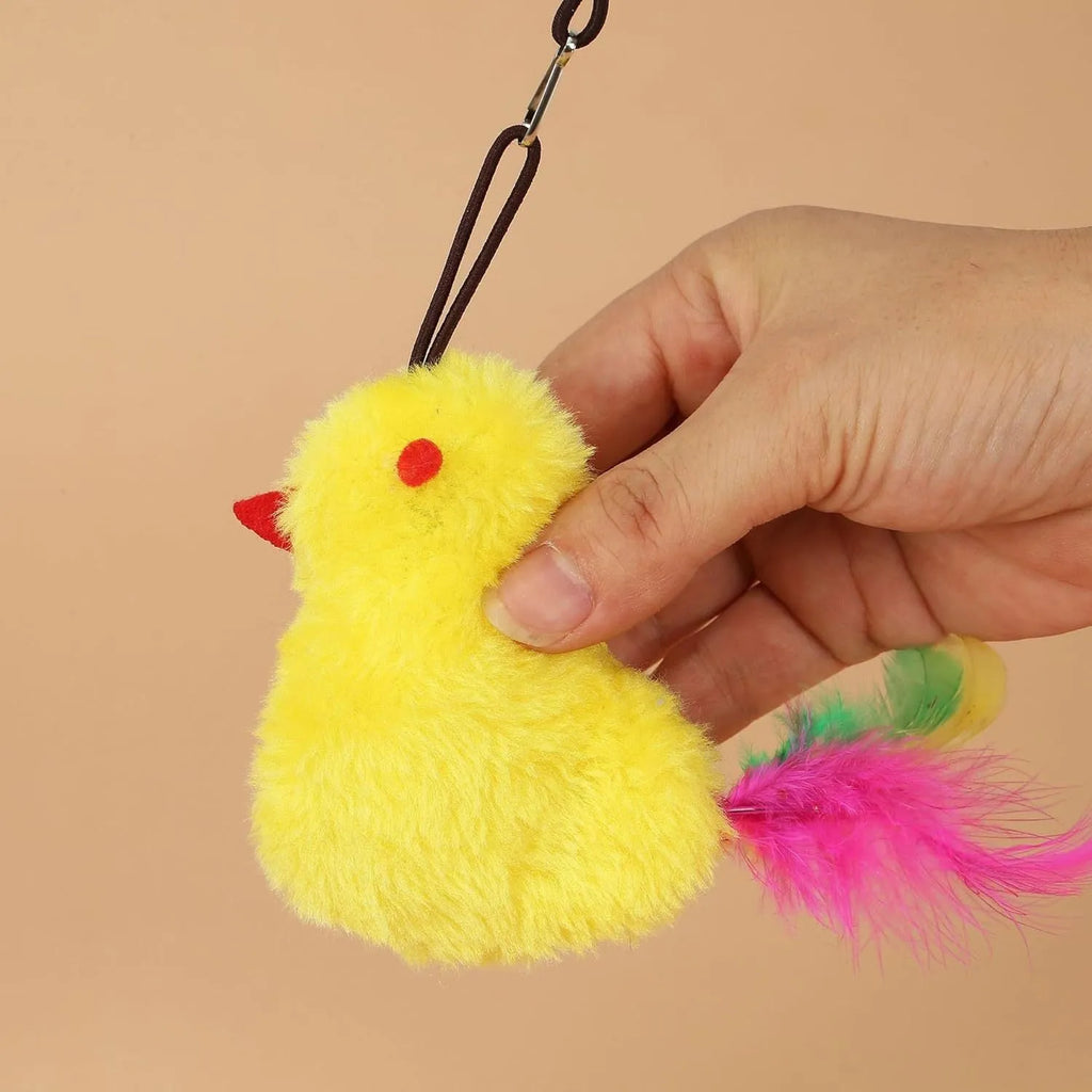 Grey and yellow hanging interactive cat toy mounted on door frame with elastic rope and treat bulb