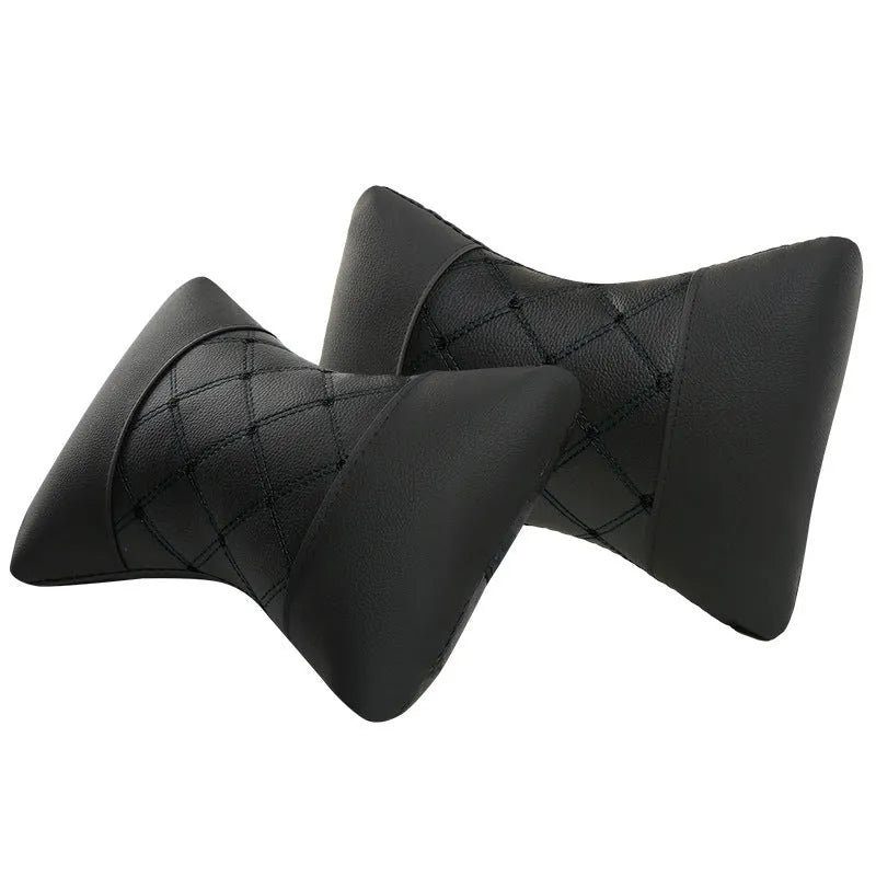 Black quilted diamond pattern car headrest neck pillow with contrast stitching.