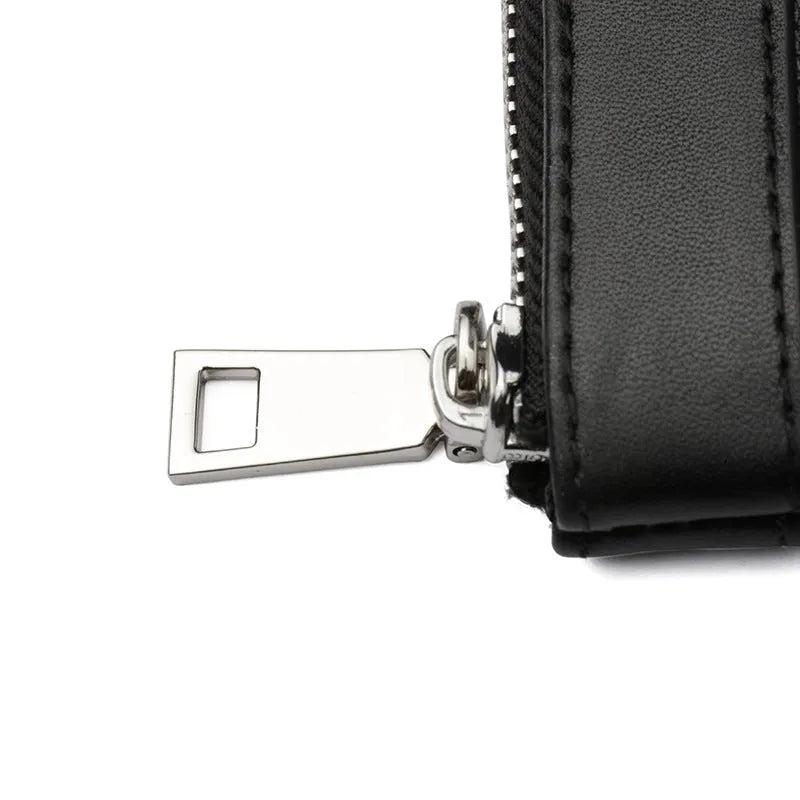 Black men's clutch wallet made of genuine cowhide leather, showing front view.