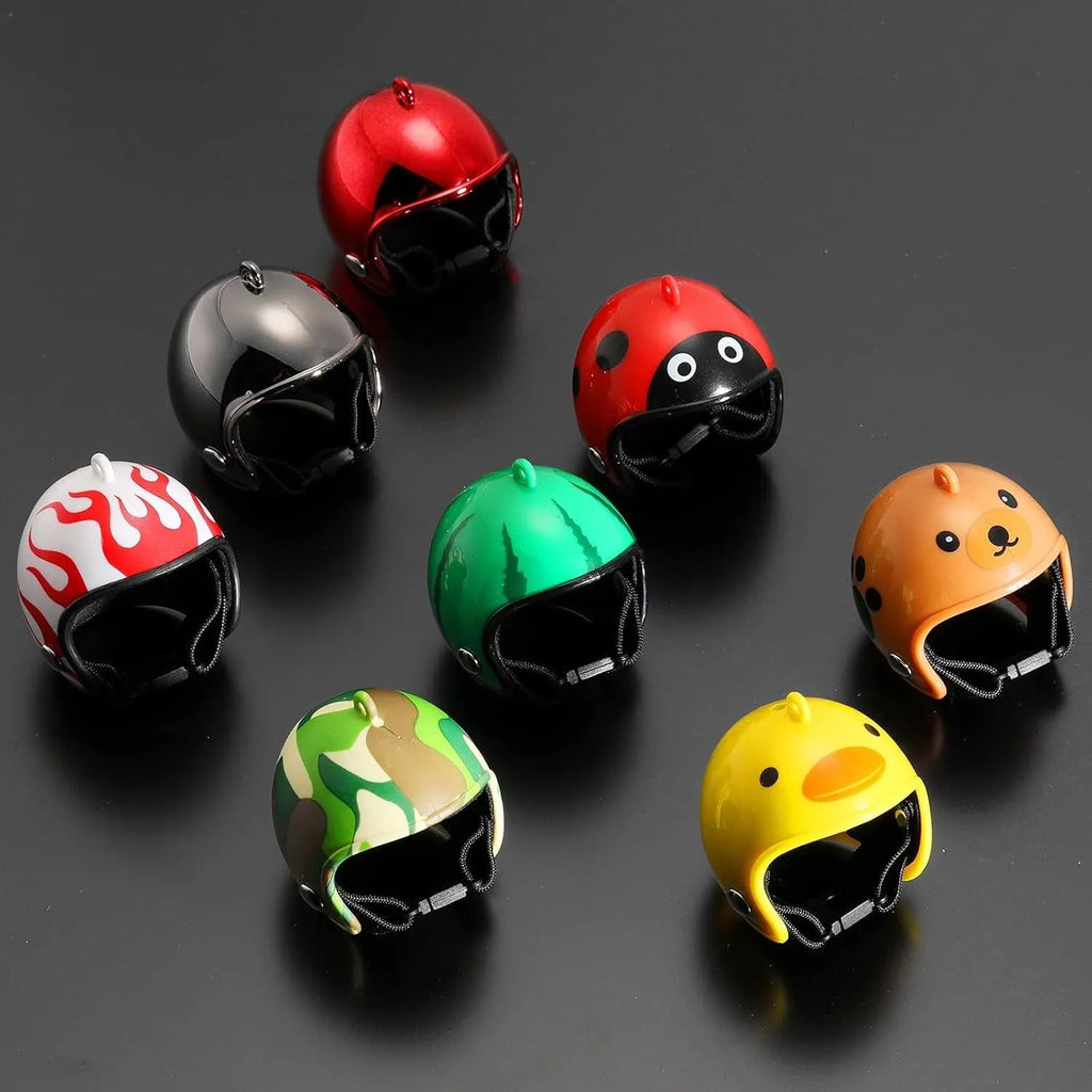 Small hard plastic helmet for a chicken or bird with elastic straps and a colourful design.