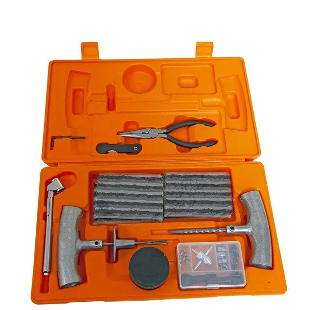 Emergency tyre repair tool kit with rubber strips, steel tools, and pressure gauge in a yellow carry case.