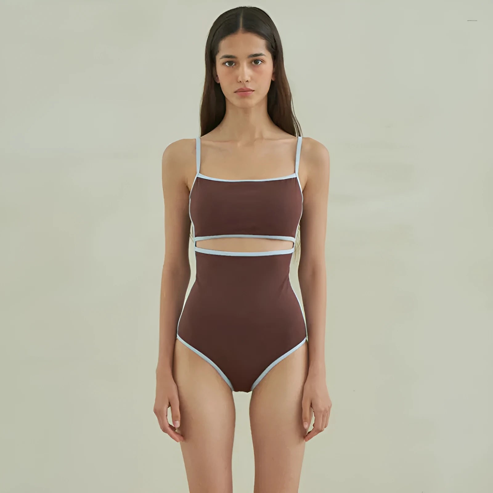 Brown triangle one-piece swimsuit for women on a hanger, showing sexy style and nylon fabric.