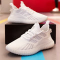 Men's white breathable fabric sports shoes with platform heel and round toe on a plain background.