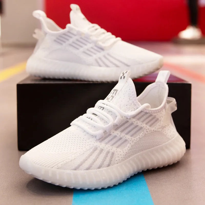 Men's white breathable fabric sports shoes with platform heel and round toe on a plain background.