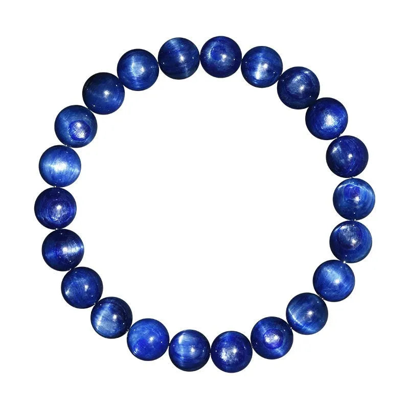 Polished blue crystal ball bracelet with geometric beads and Ruyi design on a white background.