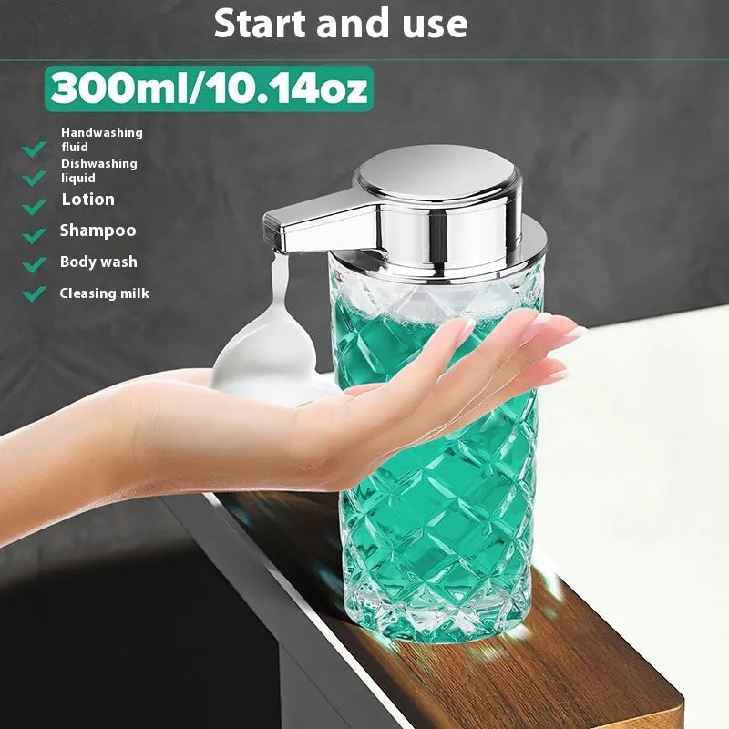 Silver automatic sensor soap dispenser with USB-C charging port on a bathroom countertop.