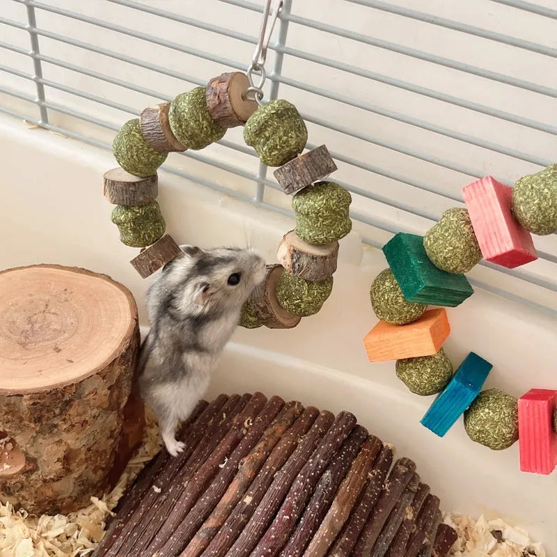 Hamster chew toy with decorative straw ball ring on wooden ring for small pets