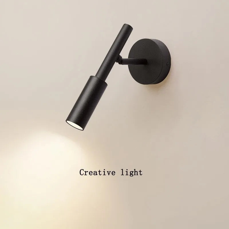 Black wrought iron modern wall light with three colour lighting options