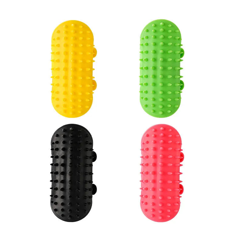 Silicone cat grooming brush with comb teeth mounted on table leg for scratching and hair removal