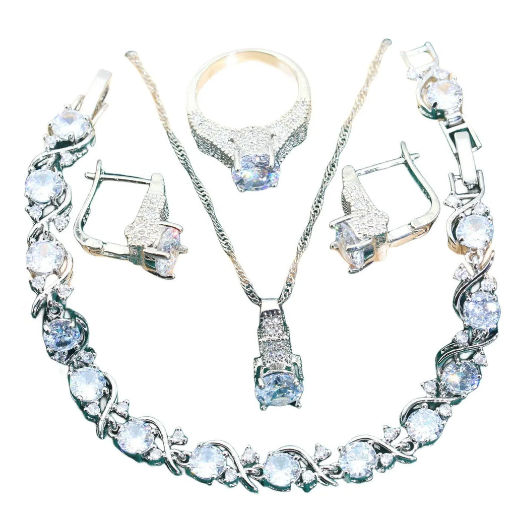 Four-piece bridal jewellery set showing necklace, bracelet, earrings, and ring with water wave chain