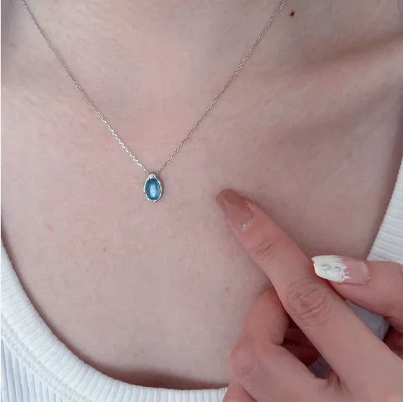 Navy blue water drop pendant necklace with adjustable cross chain in platinum colour