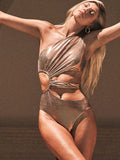 Women's gold one-piece swimsuit with backless design and high elasticity spandex construction.