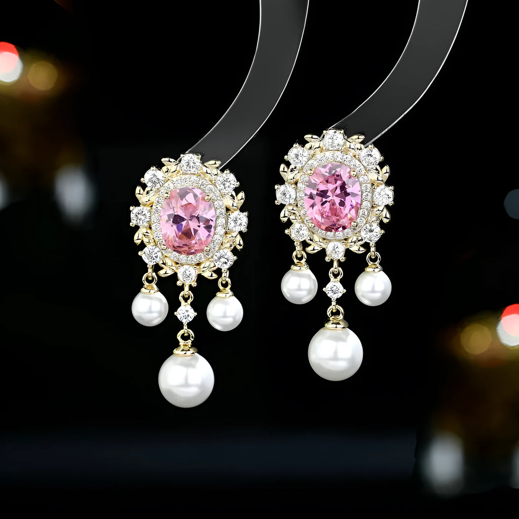 A pair of oval-shaped copper earrings with inlaid zircon stones and a dangling pearl tassel, shown in light purple.