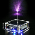 Music tesla coil with touchable arc plasma lightning on a desk next to a power supply