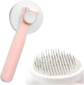 Blue self-cleaning cat brush with rubber handle and metal pins for removing loose pet fur.