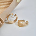 Geometric copper bracelet earrings with electroplated silver or gold finish showing stud and clip styles