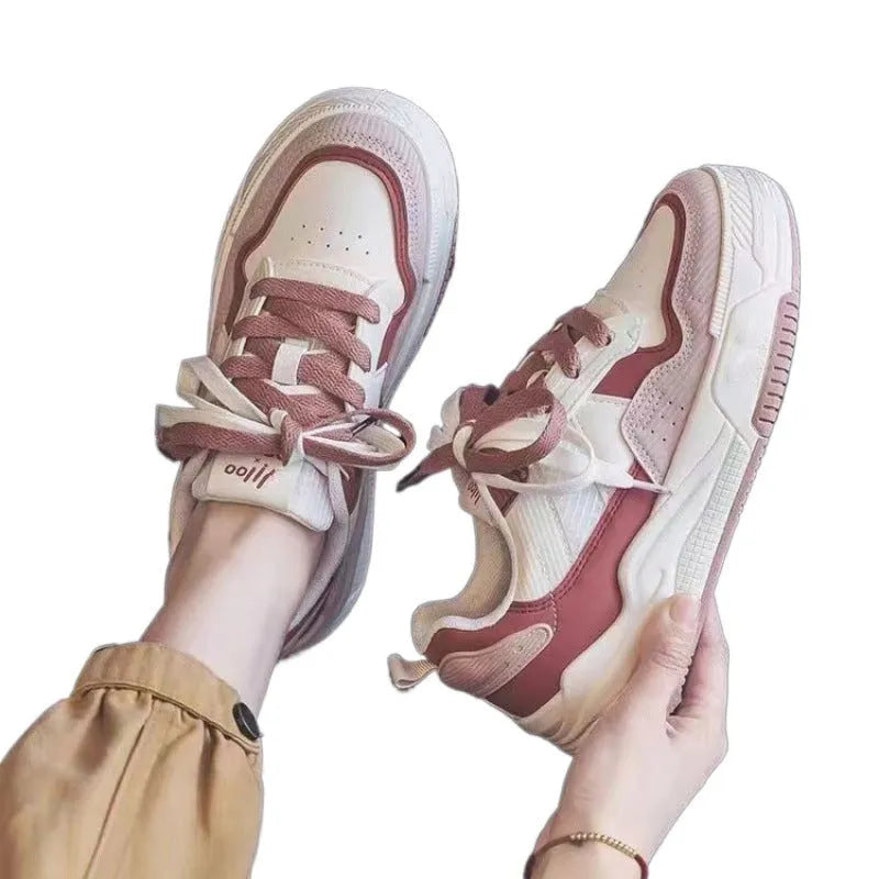 Women's pink and white low-top rubber sneakers with height increasing soles